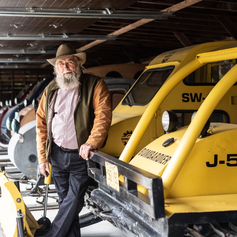 Man posing with forestry machinery