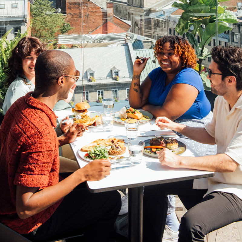 Group of friends on a rooftop terrace.