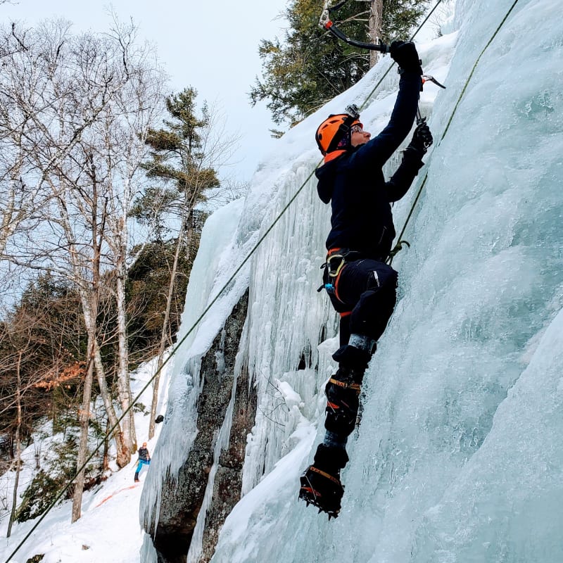 Climber on an icy cliff.