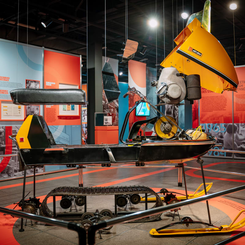 Display of pieces of a snowmobile at the Bombardier museum.
