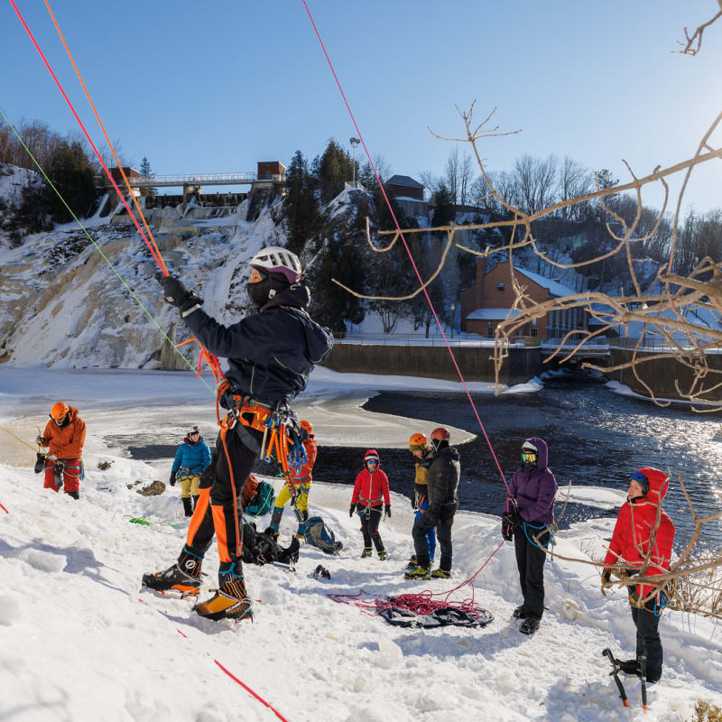 Group of people waiting to climb the ice wall.