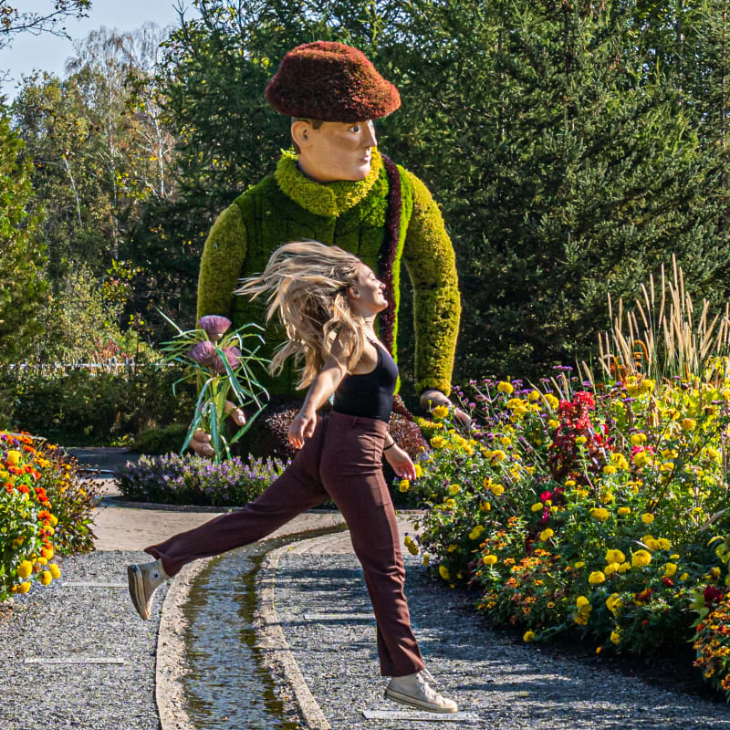 Happy young woman in the botanical gardens at Parc Marie-Victorin