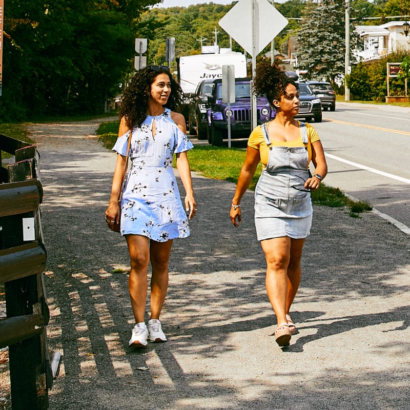 Two young girls exploring the main street in the village of Montebello.