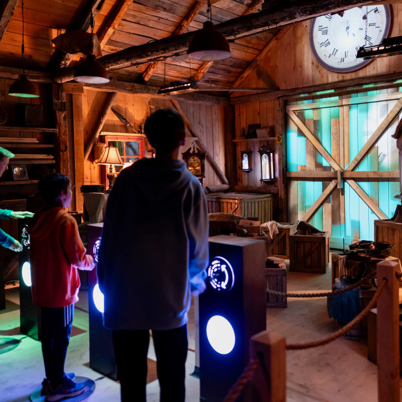 Family in the clock workshop at the Village Québécois d'Antan