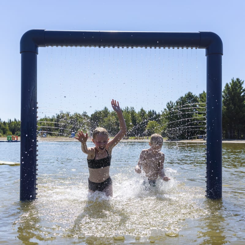 Two girls in the water at Domaine de la Chute
