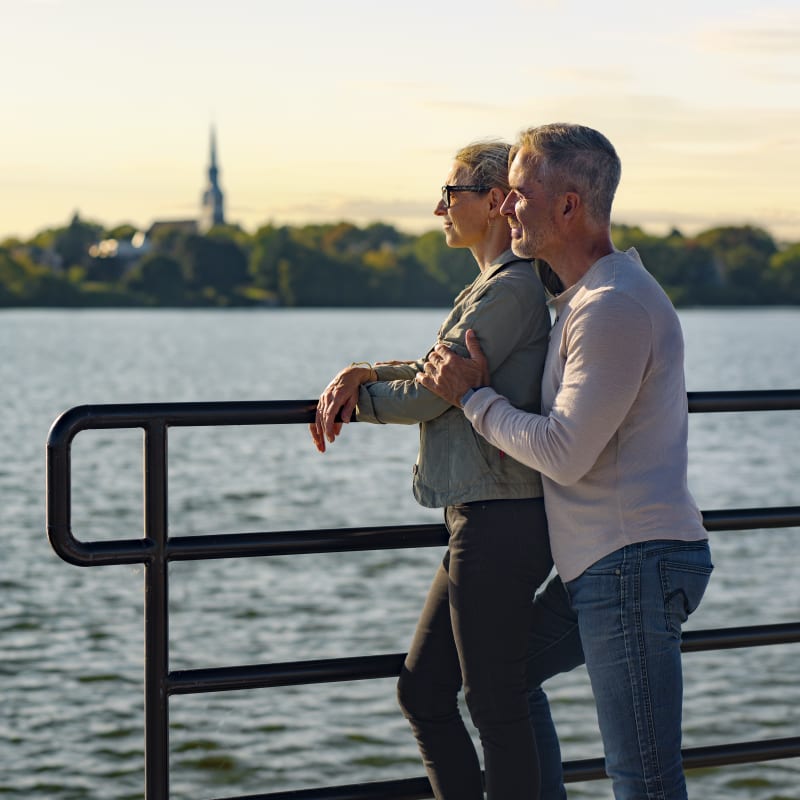 Two people next to the water.