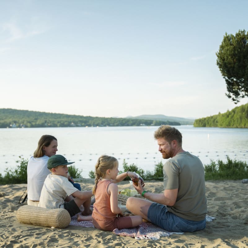 Young family at the beach at Station touristique Duchesnay.