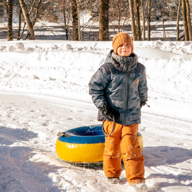 Tourisme Drummondville young boy enjoying snow tubing
