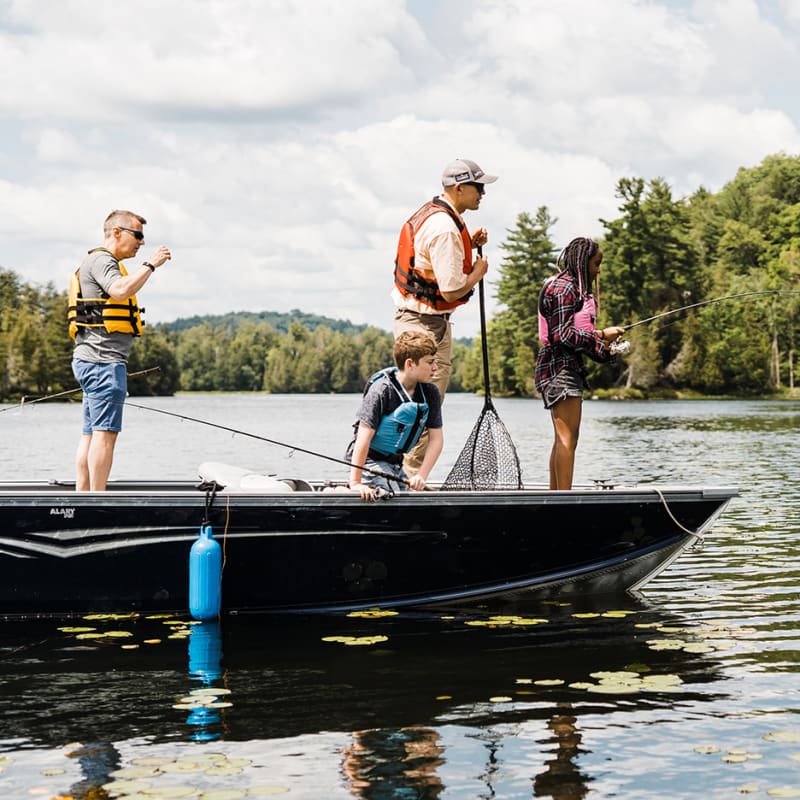 A fishing adventure in Petite Nation - Two adults and two children fishing on a small boat