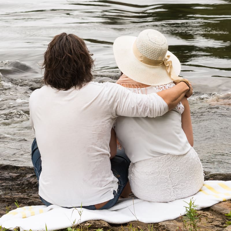Couple by a river.