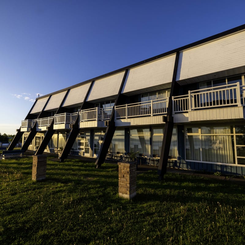 The exterior of a lodging building on a sunny day.