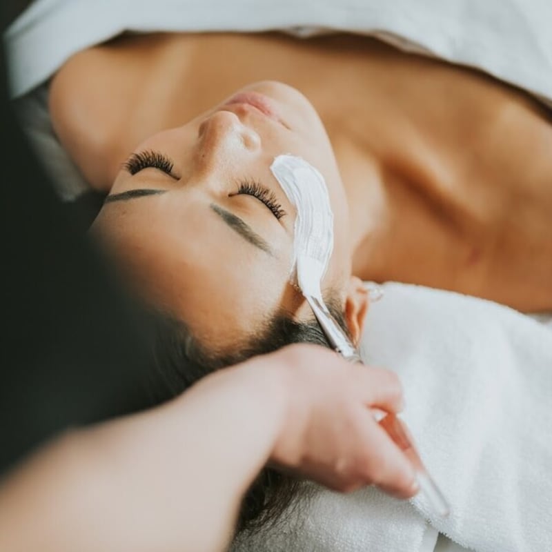 Woman receiving a facial treatment