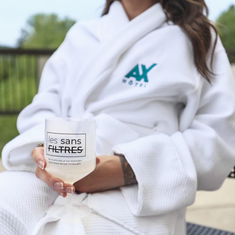 Woman in a bathrobe at Ax Hôtel Mont-Tremblant.