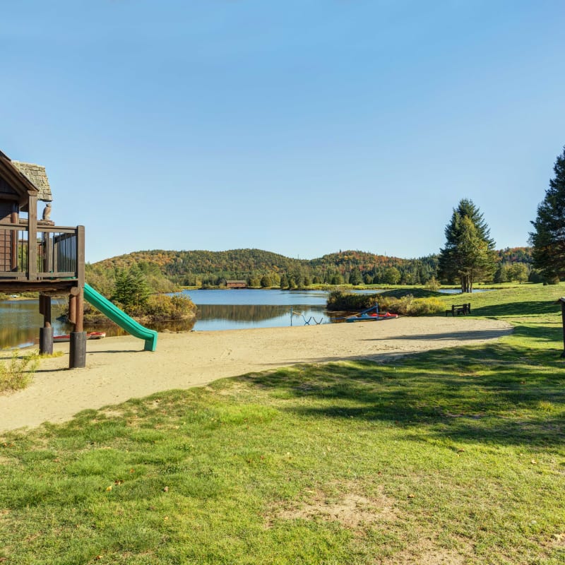 Children's playground by the lake at Chalets Royal Laurentien.