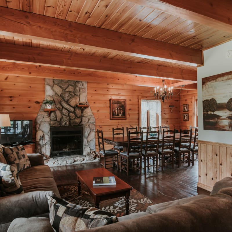 View of a living room and a large dining room in one of the Chalets Royal Laurentien.