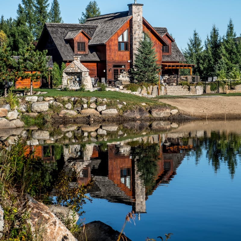 Exterior of a large wood-and-stone house at Chalets Royal Laurentien.