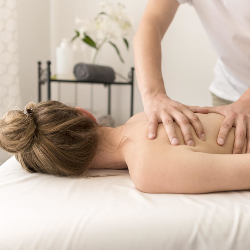 Woman receiving a back massage. 