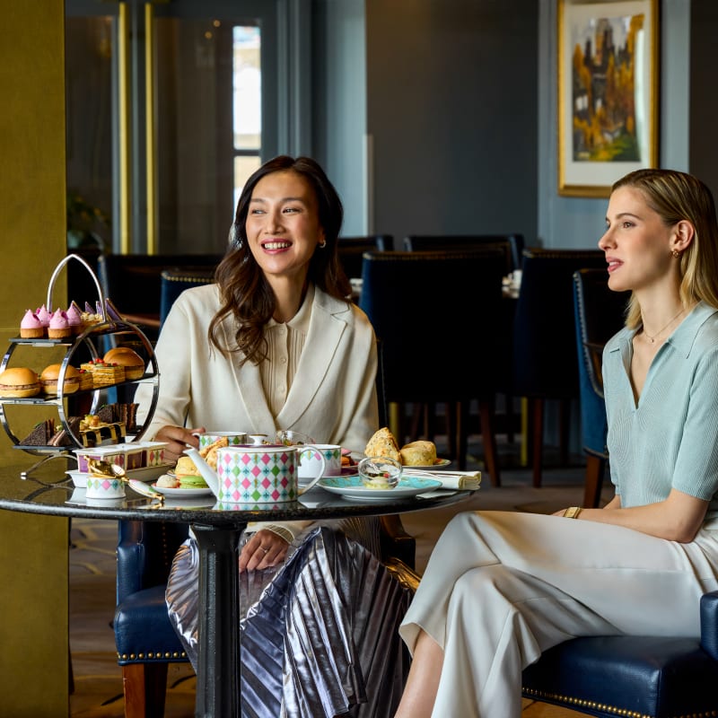 Two women having tea at the Fairmont Le Château Frontenac.