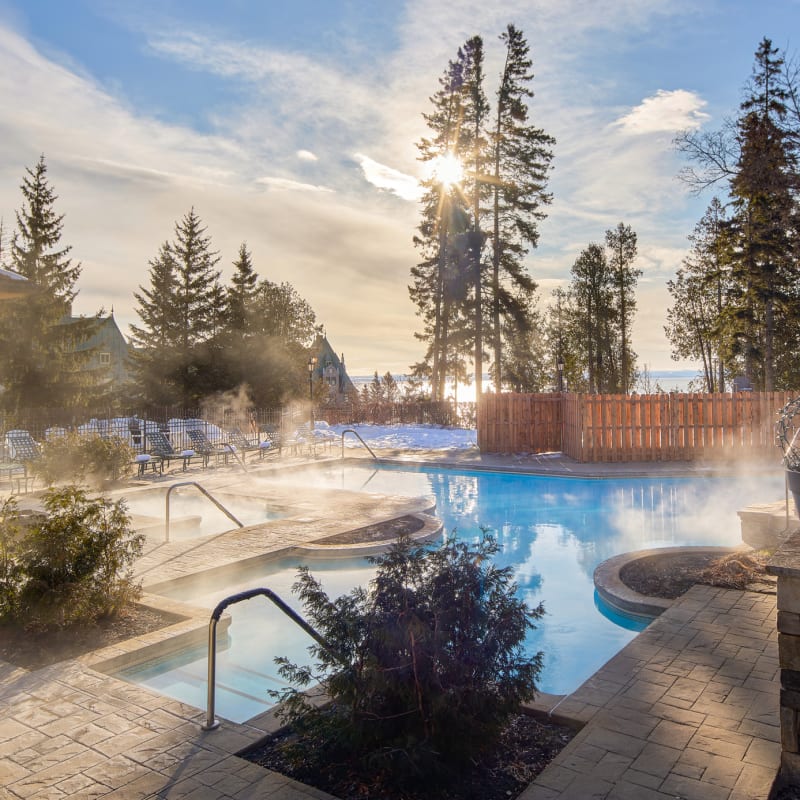 Outdoor heated pool in winter at Fairmont Le Manoir Richelieu.