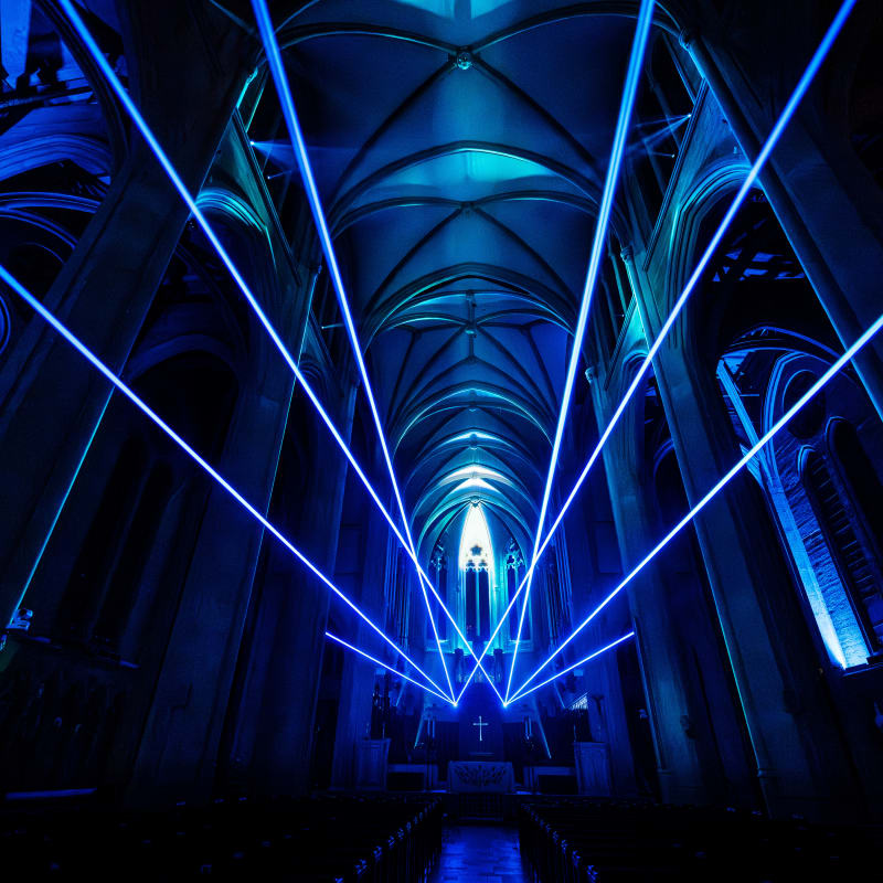 Beams of light during the AURA experiment at Grace Cathedral.