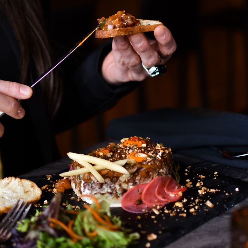 A woman enjoying a meal.