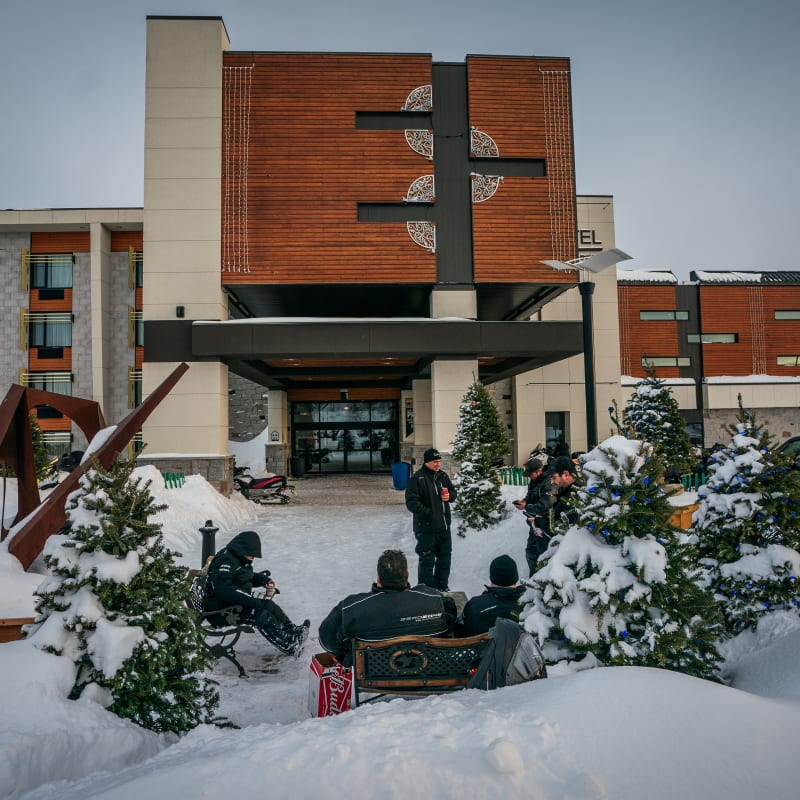 Snowmobilers in front of Hôtel Universel Rivière-du-Loup.