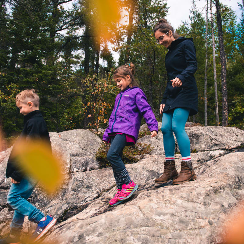 Family on a fall hike at Parc le Trou de la Fée