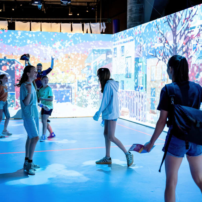 Children and teens in an interactive room. 