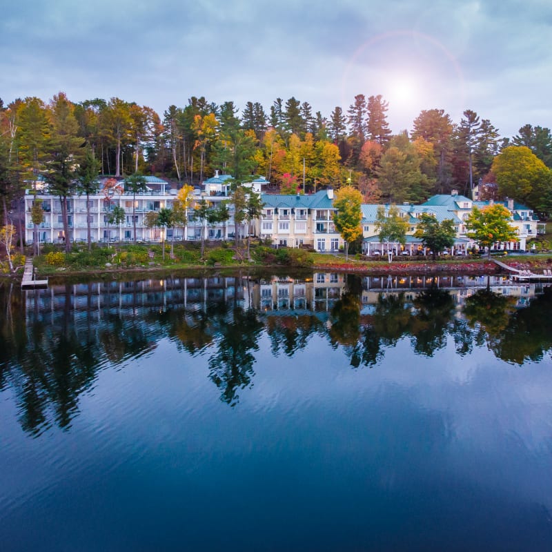 The hotel and the lake at dawn in the fall. 