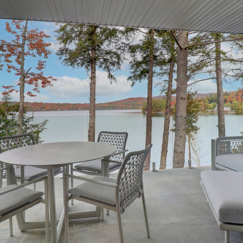 An outdoor living area by the lake in the fall.