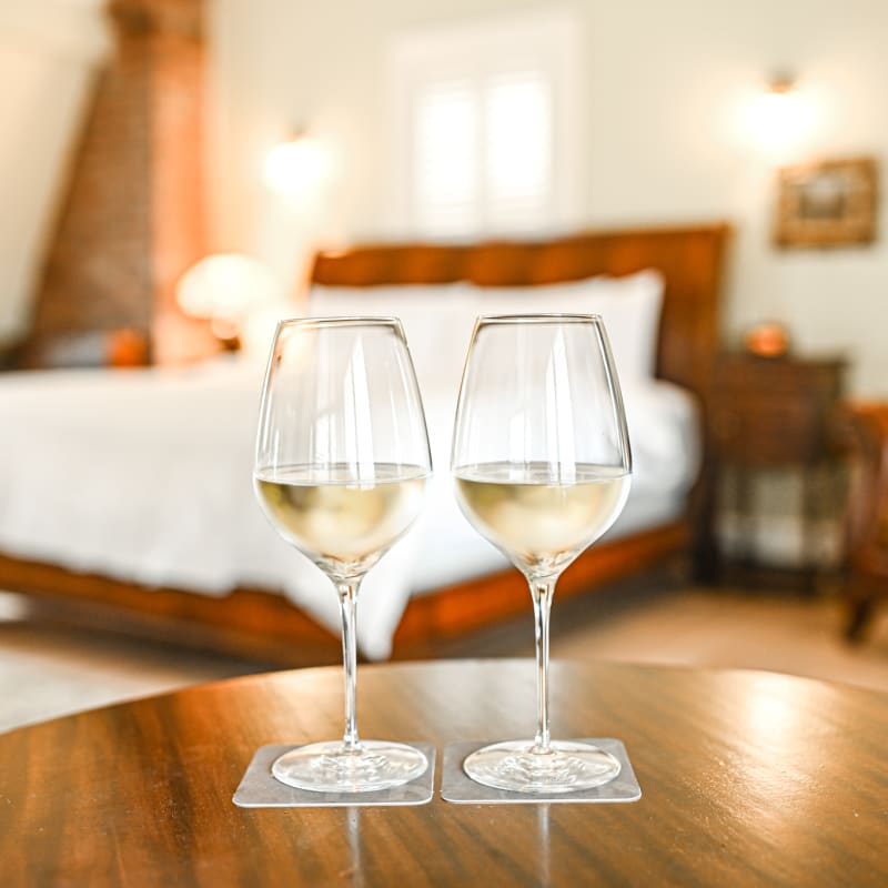 2 glasses of wine in a room at StoneHaven Le Manoir.