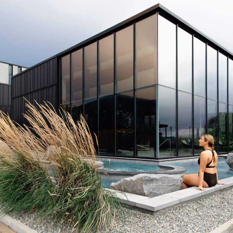 Woman by the pool at Strøm spa nordique Vieux-Québec.