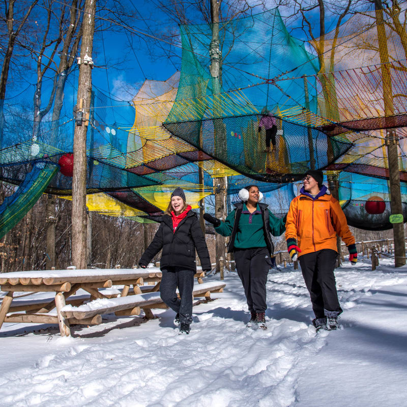 3 people at the Uplå attraction at Mont-Saint-Grégoire.