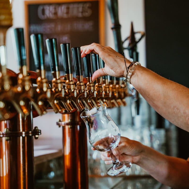 Beer on tap at a microbrewery.