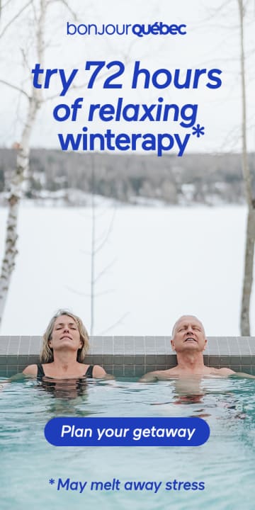 Couple relaxing in a hot tub outdoors in the winter.